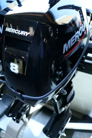 Mercury 4 cycle 8HP outboard with tiller steering, throttle tension adjustment and on the handle shifting.
