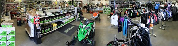 Snowmobiles, Arctic Cat oil and belts, and winter clothing at Watertown